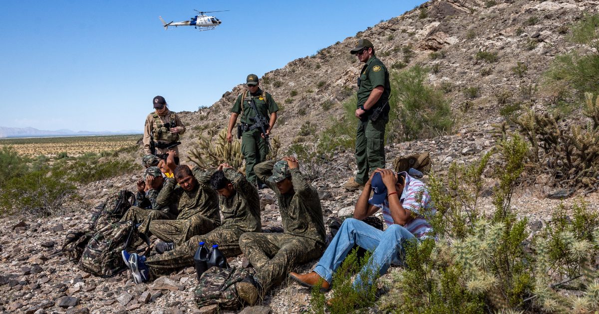 Customs and Border Protection agents detain a group of illegal immigrants on Wednesday at the Organ Pipe National Monument, Arizona.