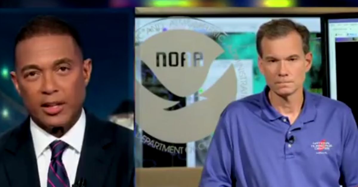 CNN host Don Lemon, left, speaks with NOAA director Jamie Rhome, right, to discuss Hurricane Ian.