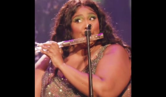 Singer Lizzo plays James Madison's flute on Tuesday in Washington, D.C.