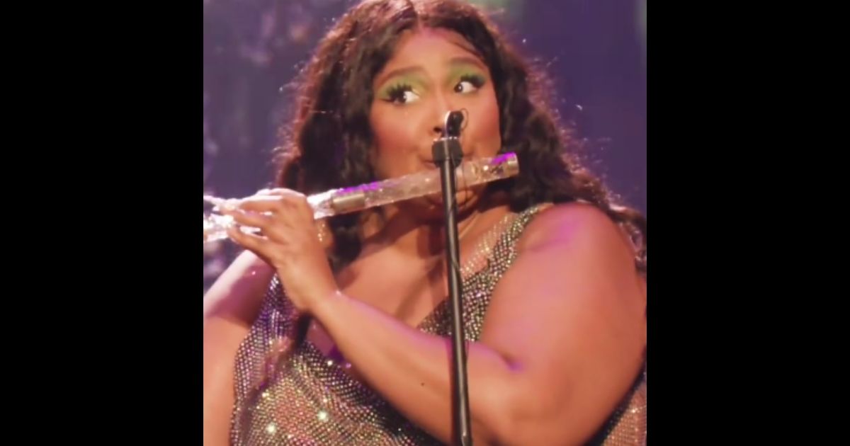 Singer Lizzo plays James Madison's flute on Tuesday in Washington, D.C.