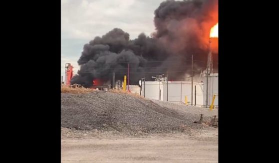 A fiery blast tore through an oil refinery near Toledo, Ohio, on Tuesday, leaving two dead.