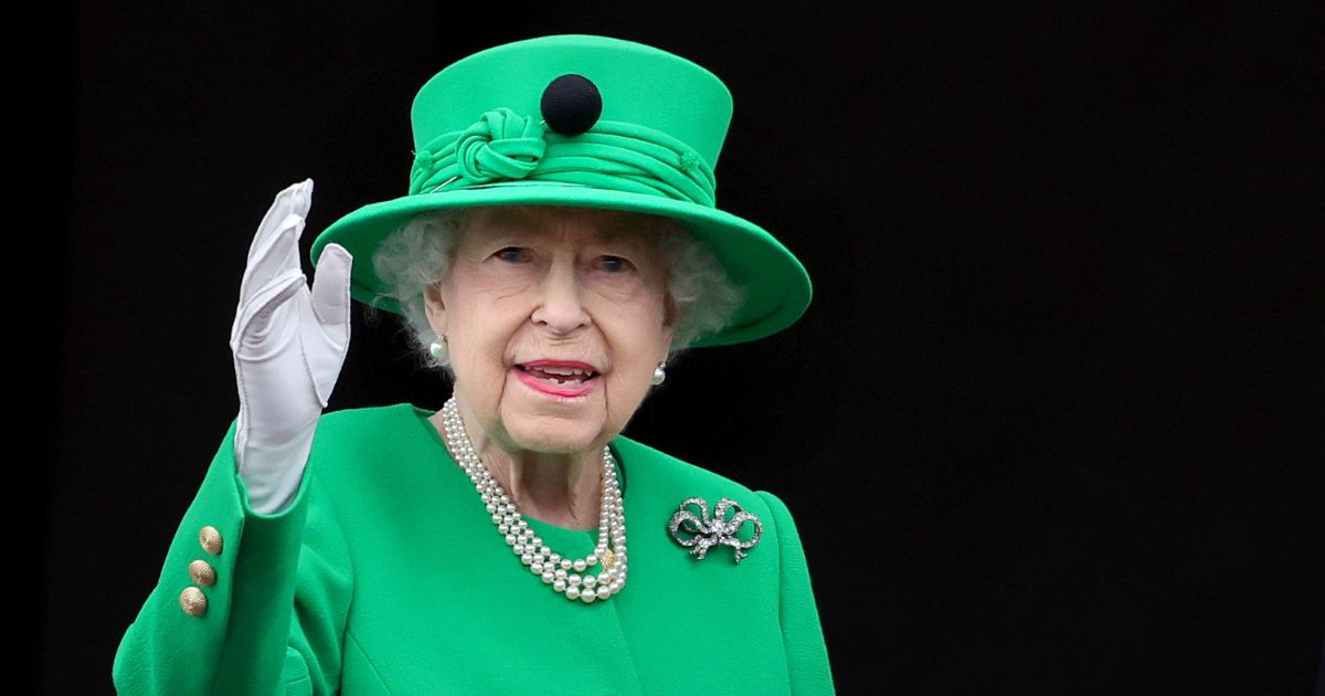 Queen Elizabeth II waves from the balcony of Buckingham Palace during the Platinum Jubilee Pageant on June 5 in London.