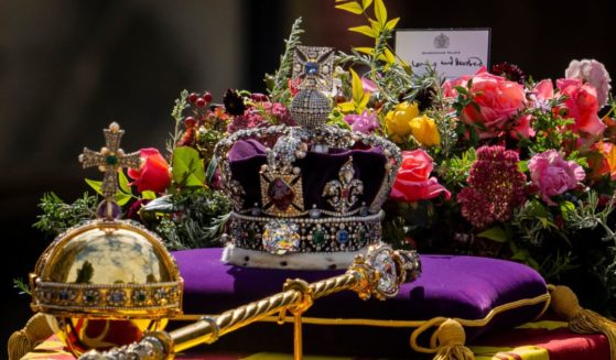 The coffin of Queen Elizabeth II leaves after the funeral service at Westminster Abbey in central London on Monday.