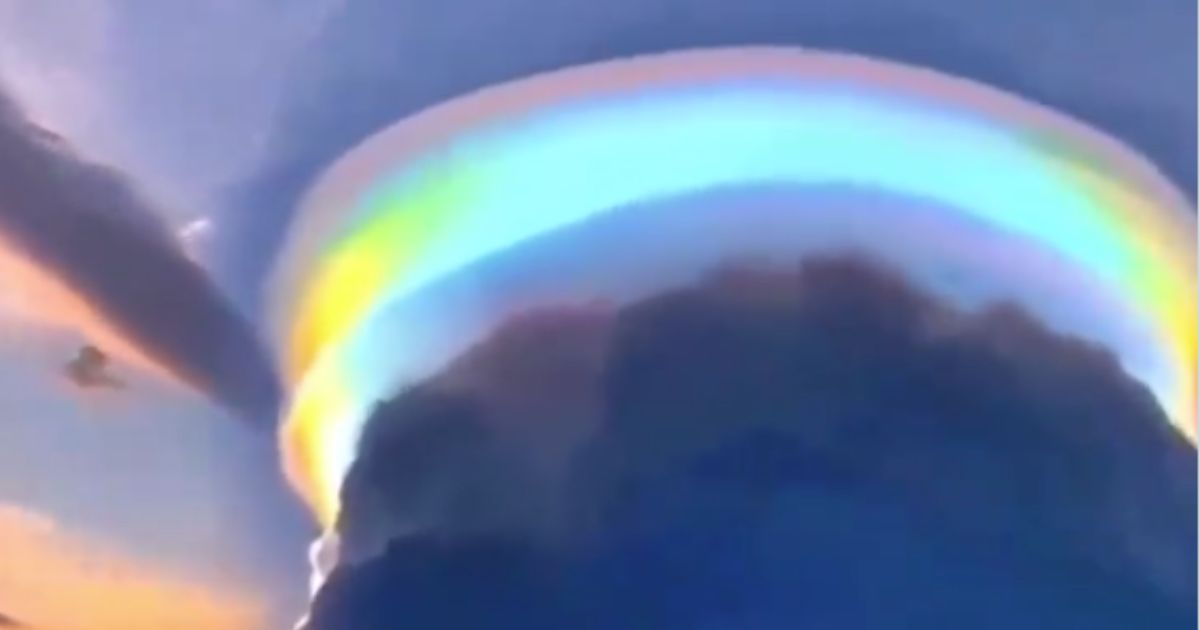 A city in southern China was the scene of a once-in-a-lifetime view as a vibrant, rainbow-colored pileus cloud formed in the sky.