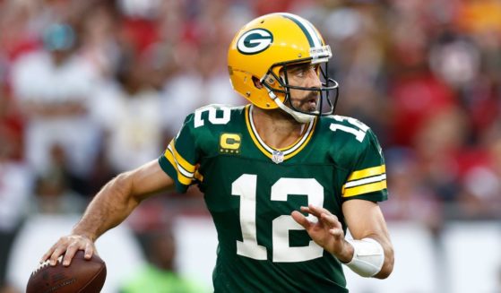 Aaron Rodgers of the Green Bay Packers looks to pass the ball against the Tampa Bay Buccaneers during the fourth quarter at Raymond James Stadium on Sunday in Tampa, Florida.
