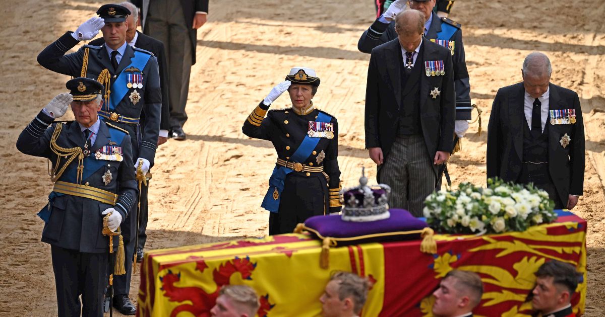 King Charles III, Prince William, Princess Anne, Prince Harry and Prince Andrew follow the coffin of Queen Elizabeth II, following a procession from Buckingham Palace on Wednesday in London.