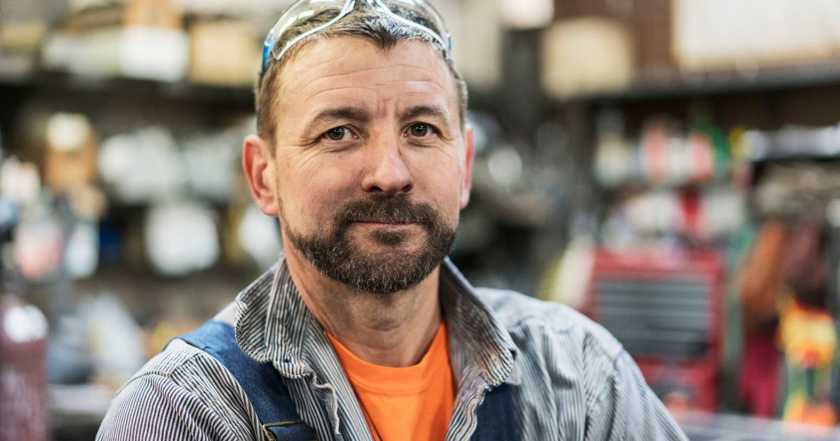A working man poses in this stock image.
