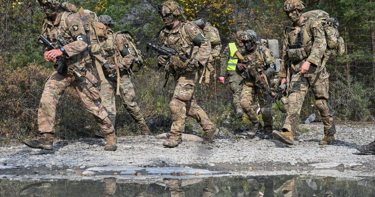 Soldiers of the 101st Airborne Division move within the circuit during the Recon Clash-22 Military Drill in Solina, Poland, on Oct. 15.