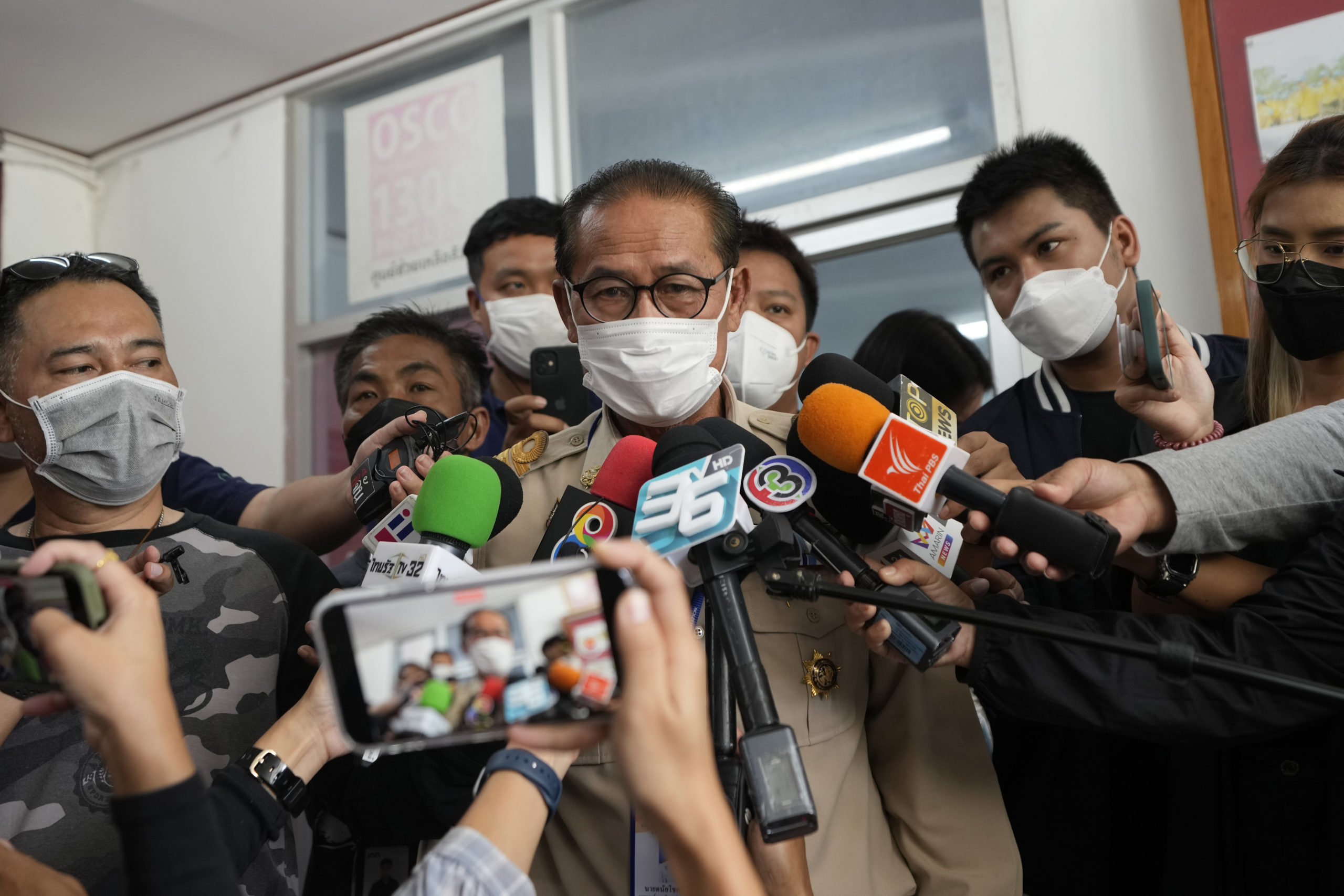 Chief executive of Uthai Sawan Sub-district Administrative Organization Danaichok Boonsom talks to reporters at a police station in Uthai Sawan, north eastern Thailand, on Sunday.