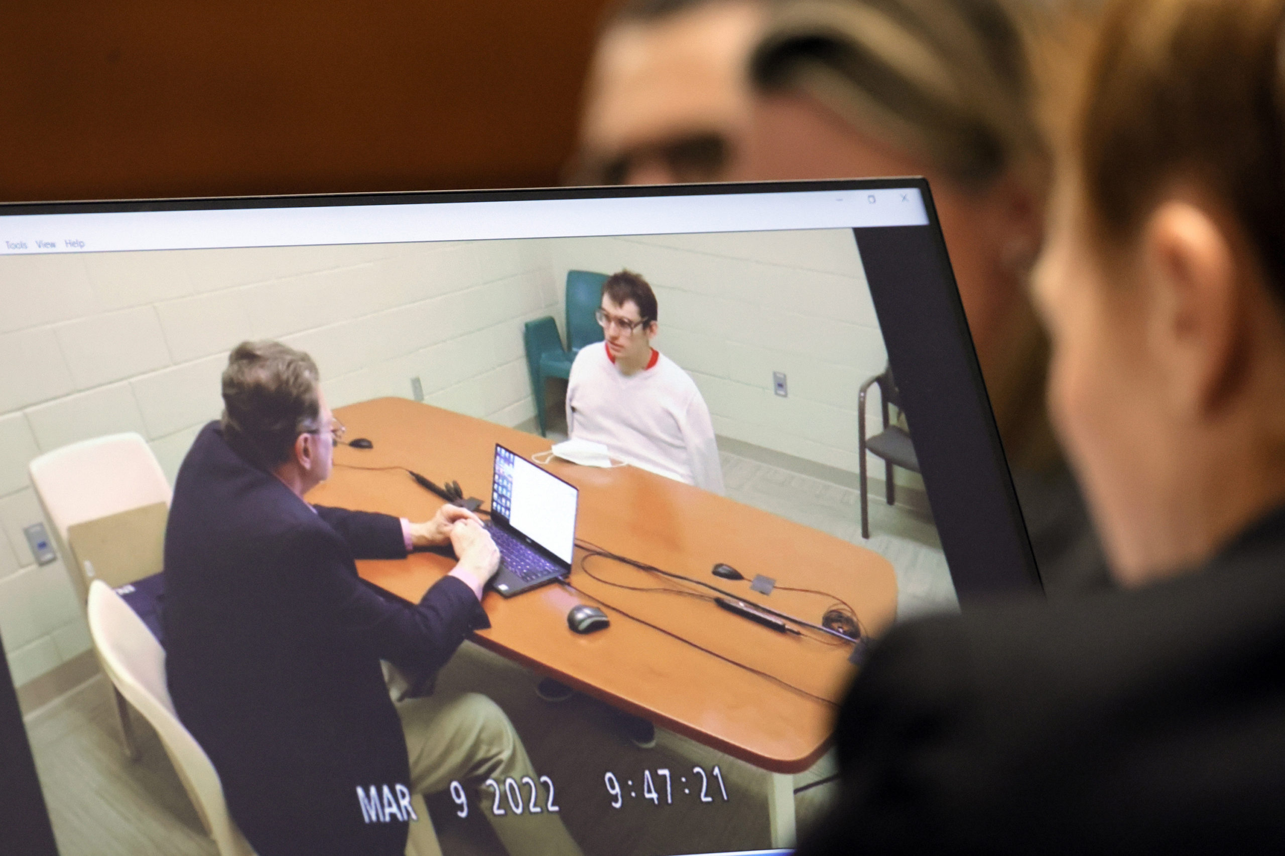 Marjory Stoneman Douglas High School shooter Nikolas Cruz is shown on a courtroom monitor during a videotaped interview with clinical neuropsychologist Dr. Robert Denney in Fort Lauderdale, Florida, on Thursday.