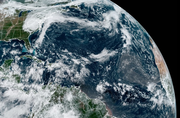 This satellite image from Saturday, Oct. 1, 2022, shows clouds associated with Tropical Rainstorm Ian in the eastern United States. Meanwhile, a few tropical waves were traversing the southern tier of the basin. (CIRA/RAMMB)