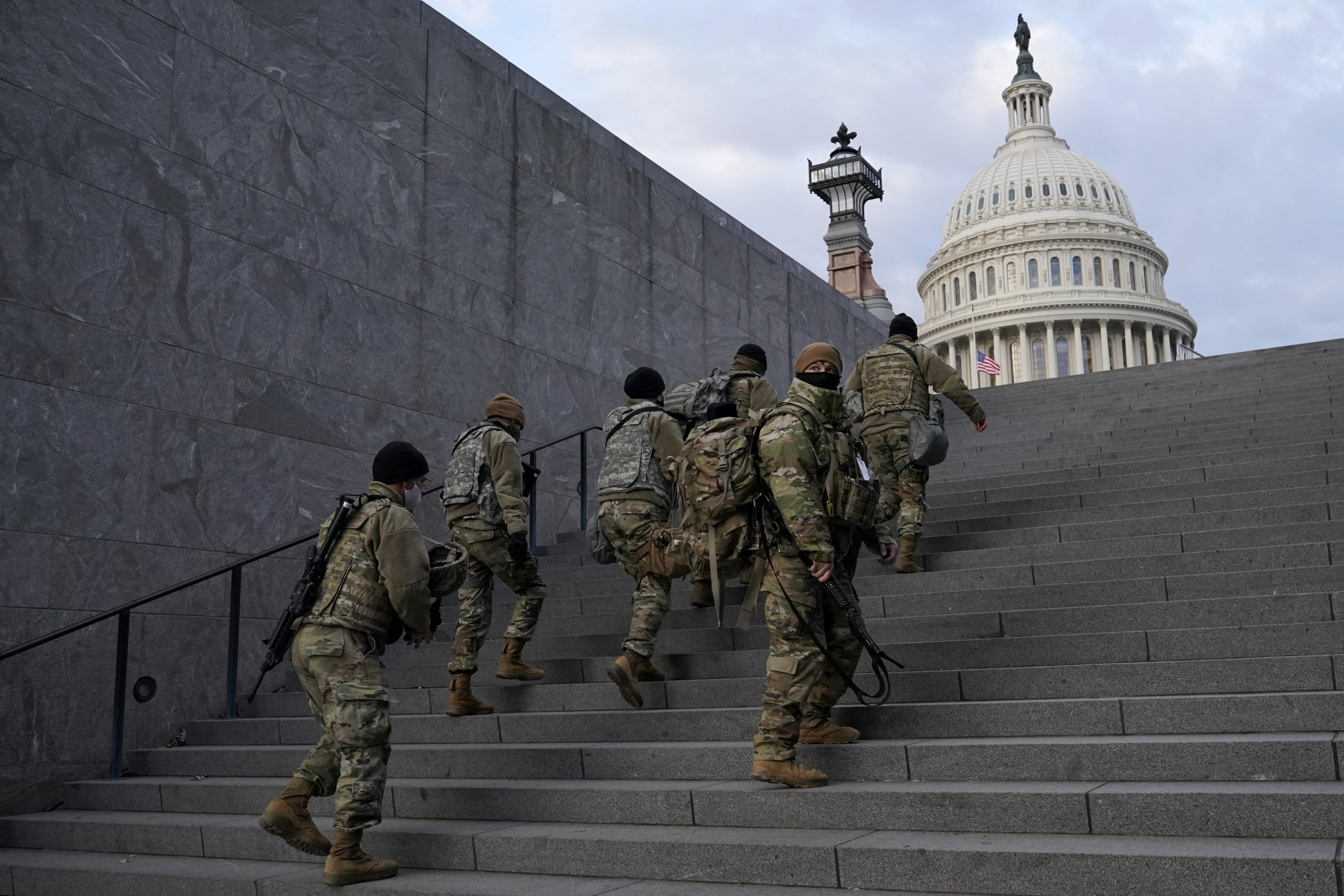 National Guard members take a staircase toward the U.S. Capitol building before a rehearsal for President-elect Joe Biden's inauguration in Washington, D.C., on Jan. 18, 2021.