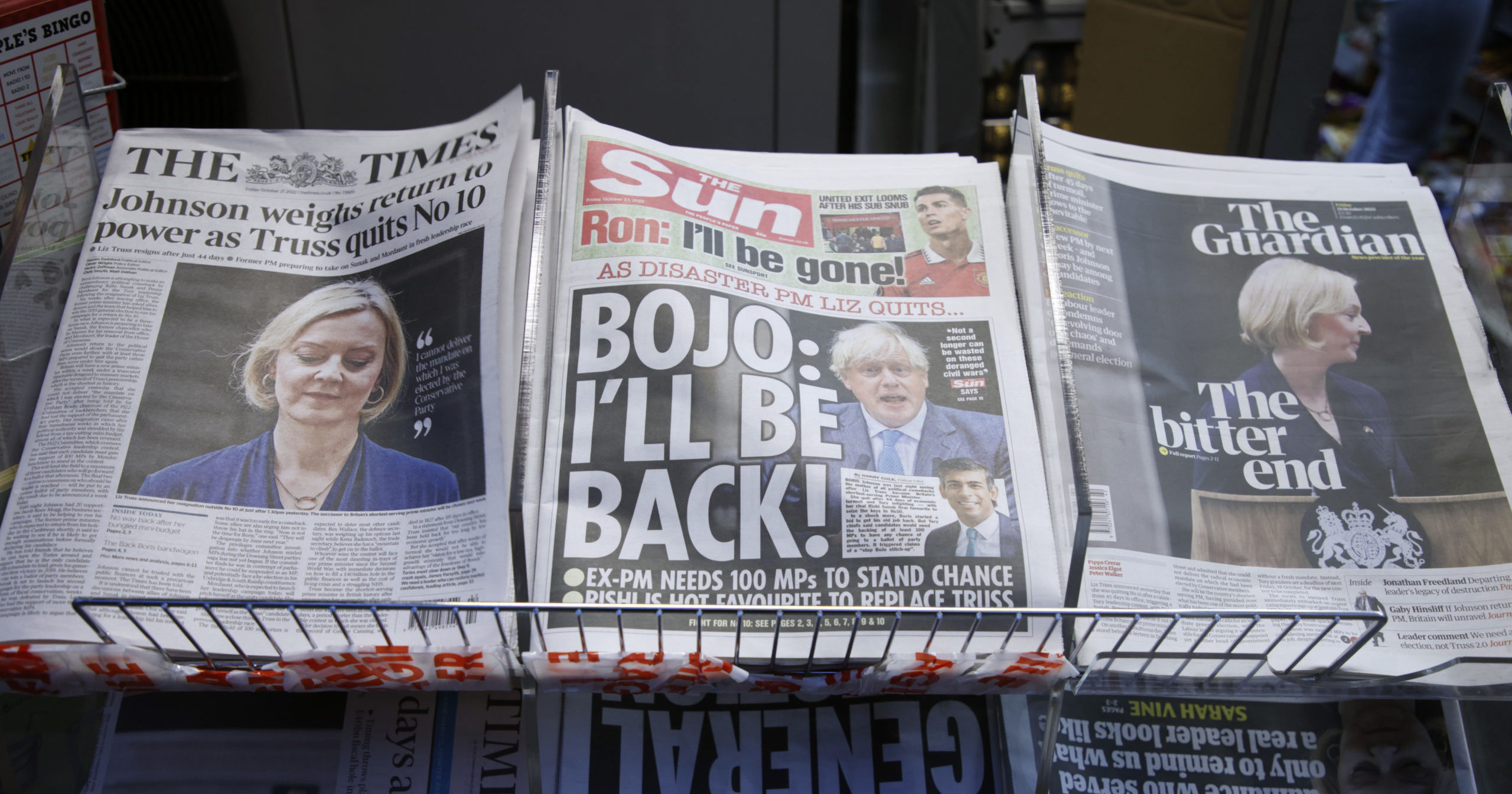 A selection of the front pages of British national newspapers shows the reaction to the resignation of Prime Minister Liz Truss in central London on Friday.