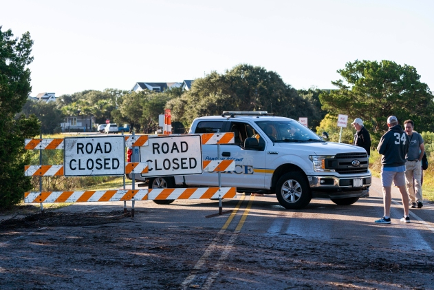 Police closed the north causeway entrance after the effects from Hurricane Ian, Saturday, Oct. 1, 2022, in Pawleys Island, S.C. (AP Photo/Alex Brandon)