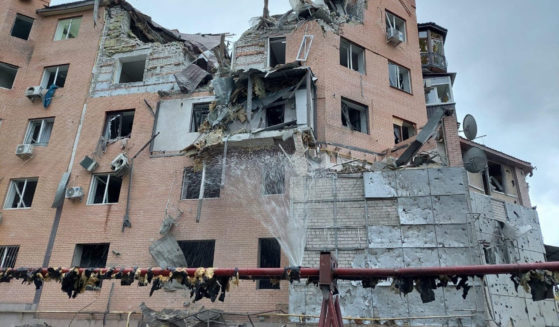 A residential building is seen damaged following night shelling in Mykolaiv, Ukraine, on Sunday.