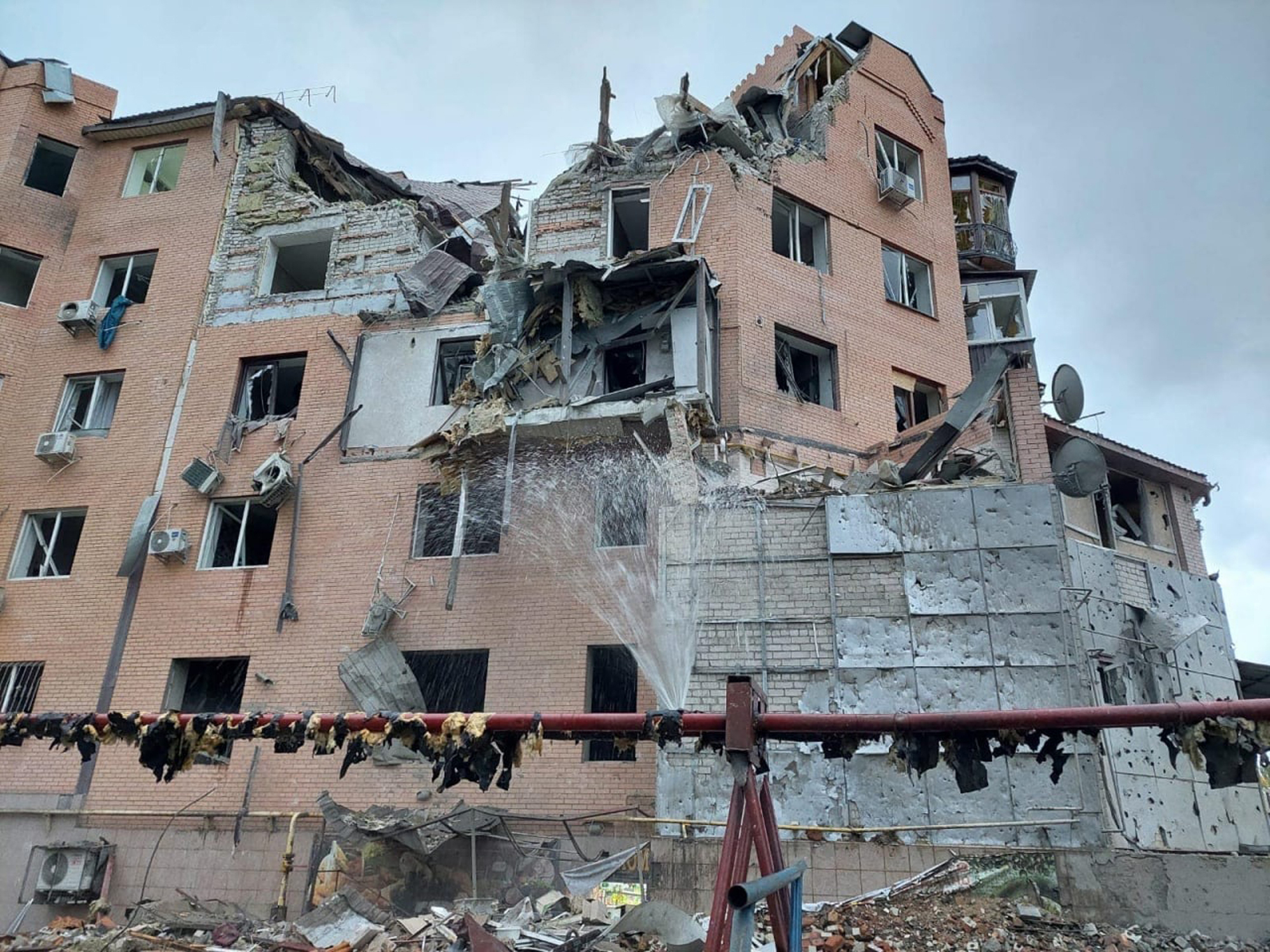 A residential building is seen damaged following night shelling in Mykolaiv, Ukraine, on Sunday.