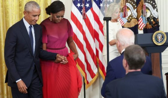 Former President Barack Obama and former first lady Michelle Obama are seen in a file photo taken during a September visit to the White House.