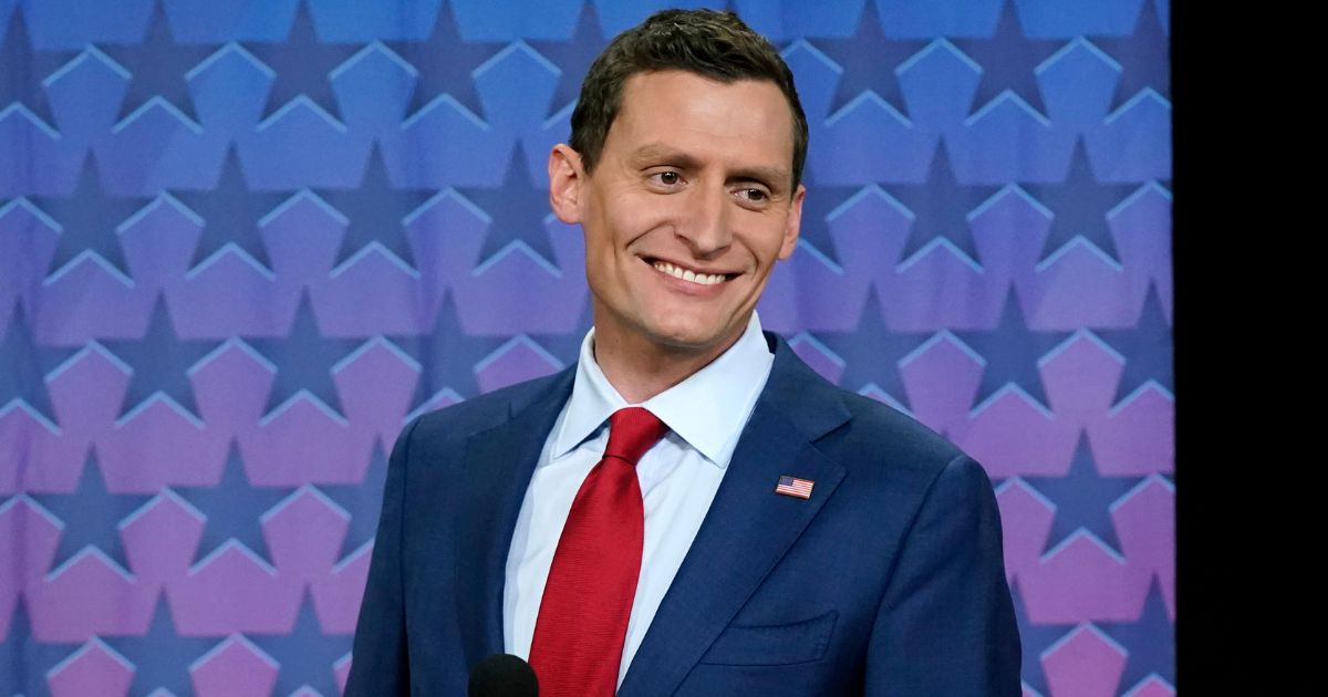 Republican Senate challenger Blake Masters smiles on stage prior to a televised debate with Arizona Democratic Sen. Mark Kelly and Libertarian candidate Marc Victor in Phoenix, Thursday.