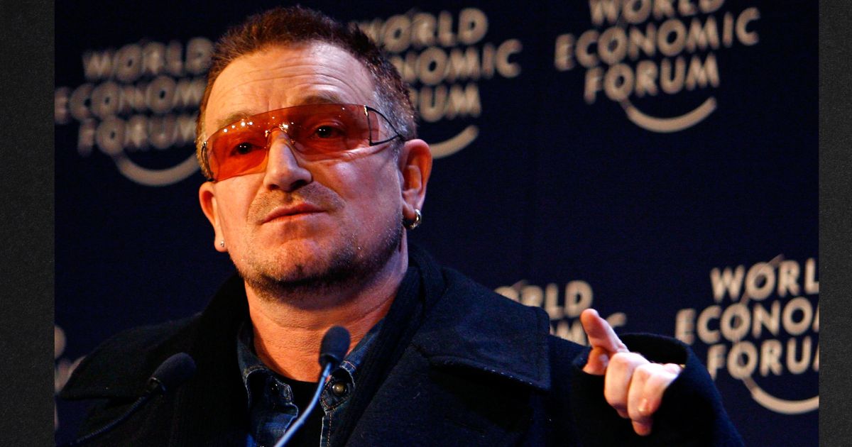 Rock star Bono, seen in a file photo from a 2008 appearance at the World Economic Forum, told the New York Times his views on capitalism have softened in recent years.