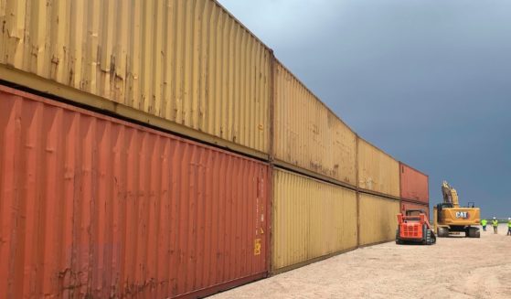Shipping containers are used to fill a 1,000-foot gap in the U.S. border wall with Mexico near Yuma, Arizona, on Aug. 12.