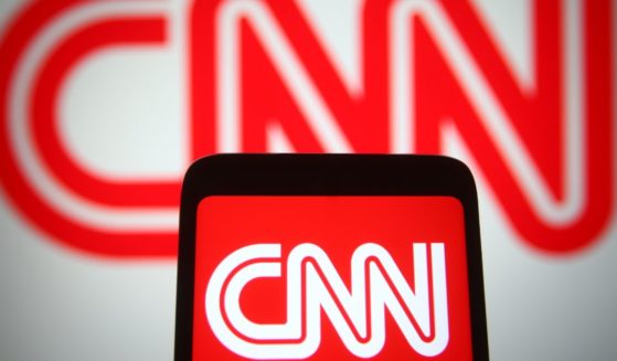 The CNN logo is displayed on a cellphone in this stock image.