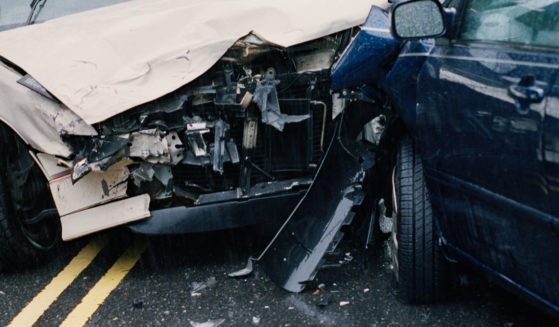 This stock photo shows damaged cars after a crash.