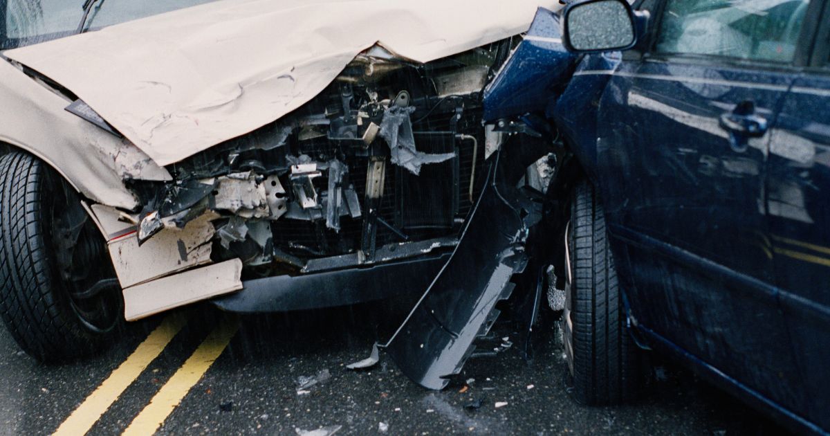This stock photo shows damaged cars after a crash.