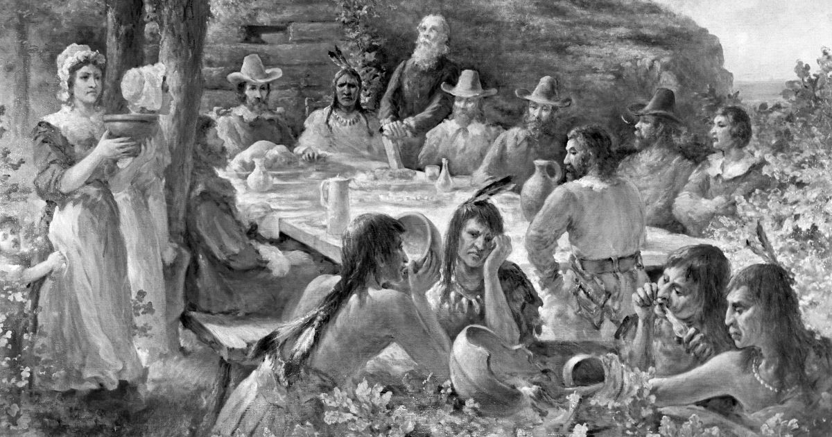 Pilgrims and Native Americans share a the first Thanksgiving meal together in the Plymouth colony of Massachusetts in 1621.