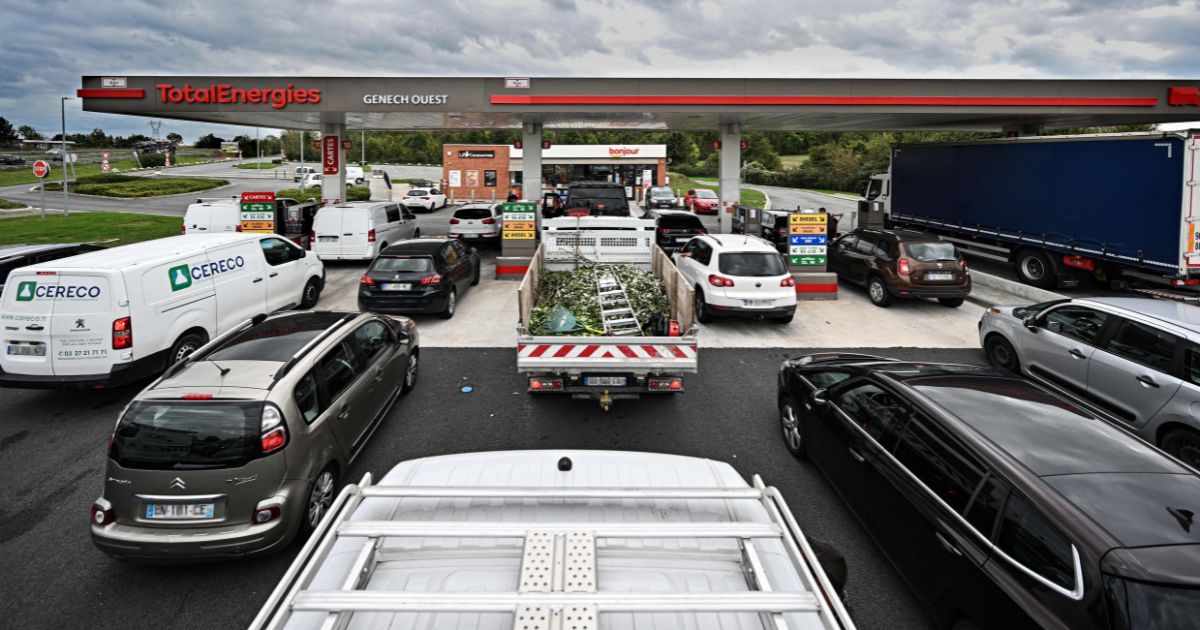 Drivers wait in long lines to fill up at a Total Energies gas station in Genech, France, on Wednesday.