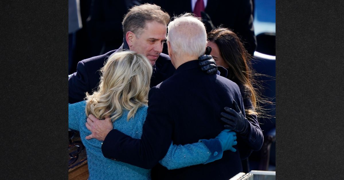 Hunter Biden shares a group hug with his dad, President Joe Biden, and stepmom Jill Biden after Biden was sworn in during his inauguration on January 20, 2021.