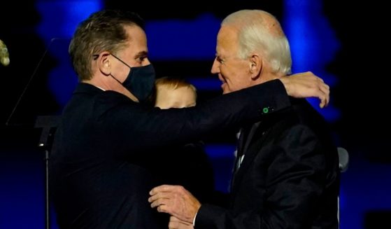 Hunter Biden, left, hugs his father, then-President elect Joe Biden, right, after he addressed the nation from Wilmington, Delaware, on Nov. 7, 2020.