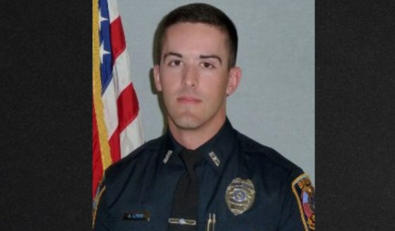 Wounded in the leg when a man opened fire, Officer Alec Iurato managed to take cover behind a police car and return a single shot, killing the suspect.