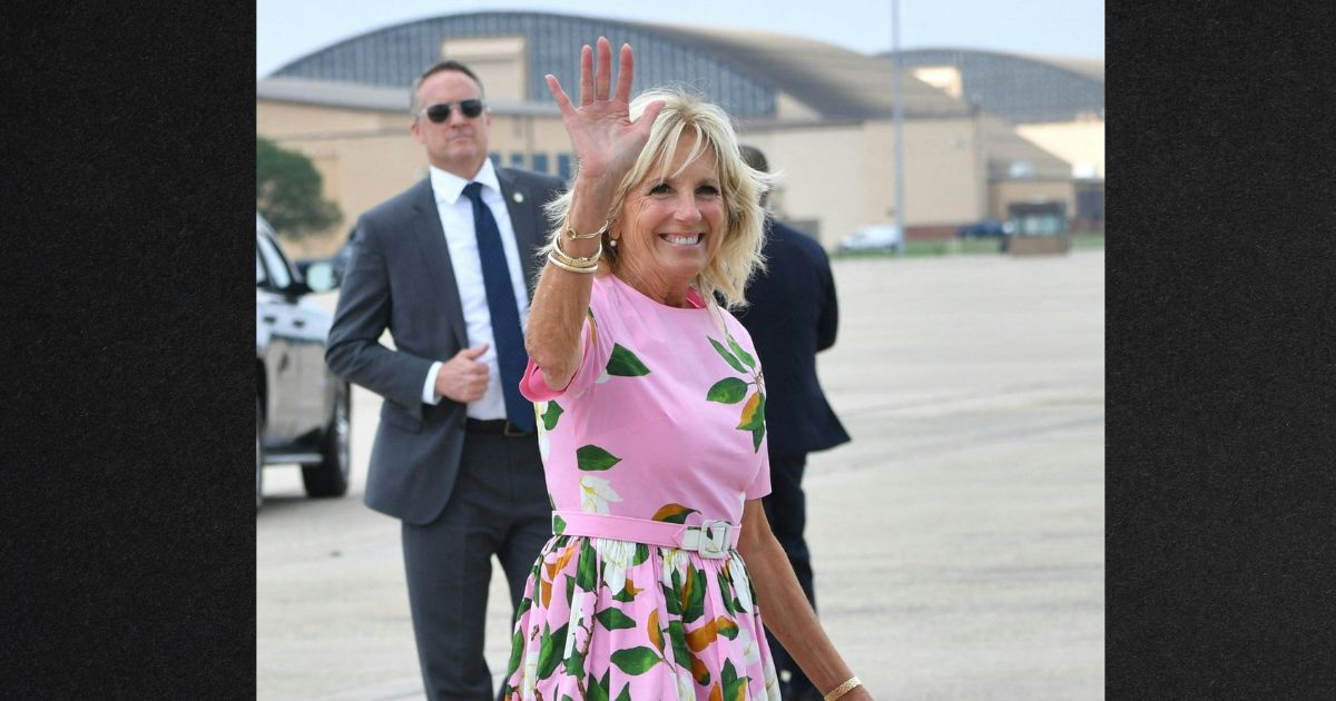 First lady Jill Biden waves before boarding Air Force One to depart Joint Base Andrews in Maryland in August.