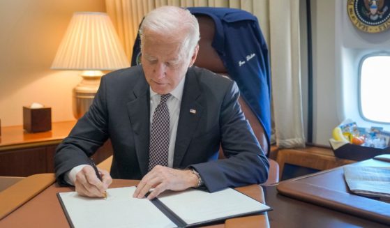 Joe Biden signing something