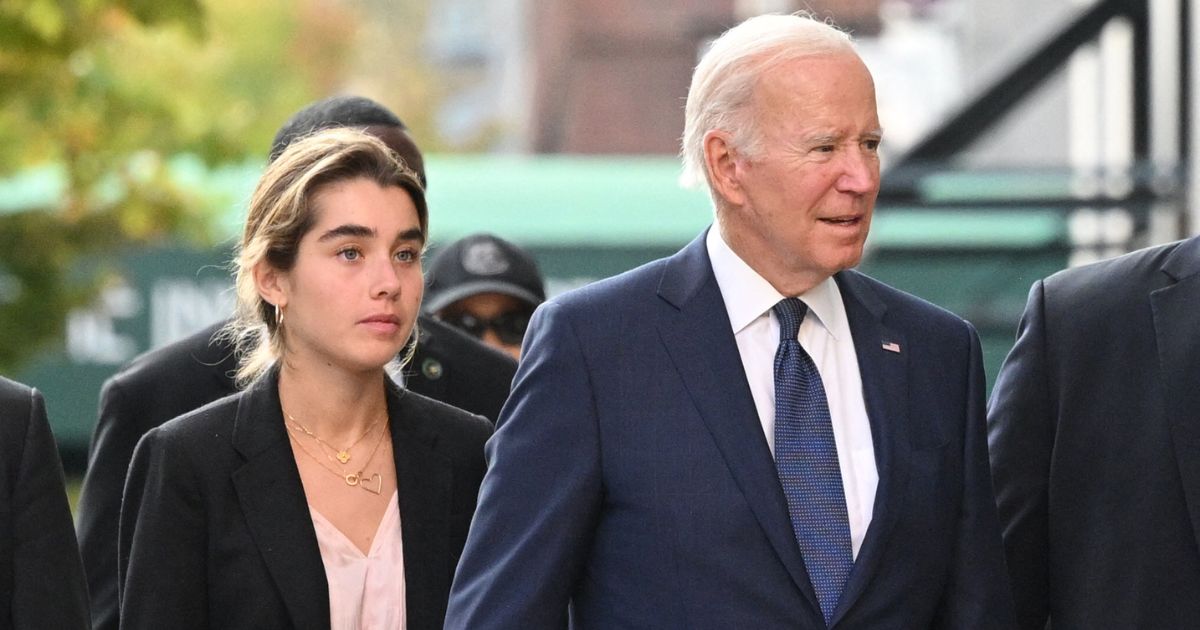 President Joe Biden, right, walks to the University of Pennsylvania bookstore with granddaughter Natalie Biden, left, during a visit to the campus in Philadelphia on Friday.