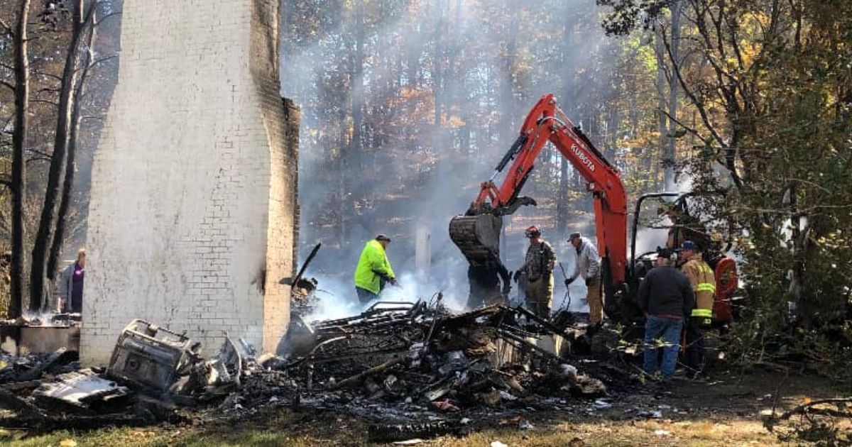 Firefighters in Edmonton, Kentucky, search the rubble of the home where former appeals judge and gubernatorial candidate Thomas Emberton died early Thursday.