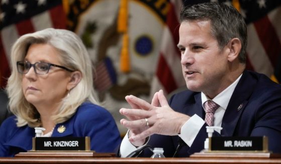 Rep. Adam Kinzinger delivers remarks alongside Rep. Liz Cheney during a hearing of the Jan. 6 committee in the Cannon House Office Building on Thursday in Washington, D.C.
