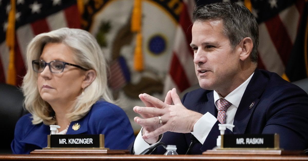 Rep. Adam Kinzinger delivers remarks alongside Rep. Liz Cheney during a hearing of the Jan. 6 committee in the Cannon House Office Building on Thursday in Washington, D.C.