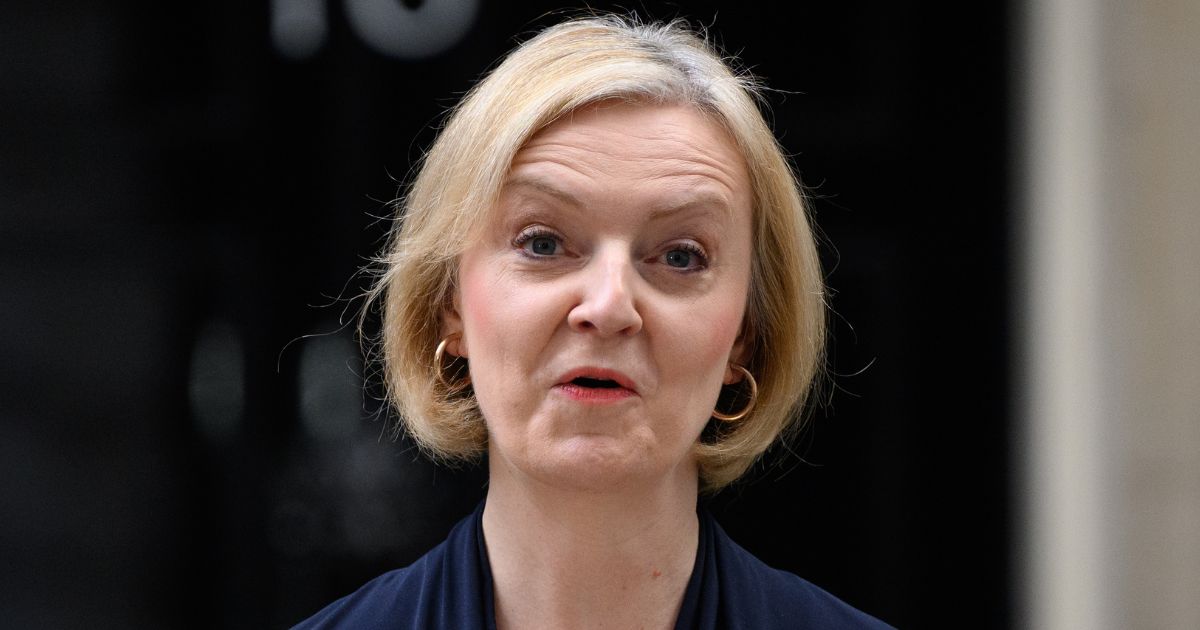 British Minister Liz Truss announces her resignation as she addresses the media outside No. 10 Downing Street in London on Thursday.