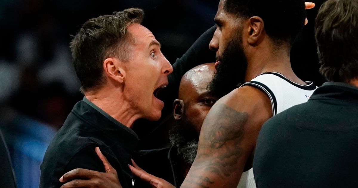 Brooklyn Nets head coach Steve Nash is restrained after having a technical foul called on him during the second half of a game at Fiserv Forum in Milwaukee on Wednesday.
