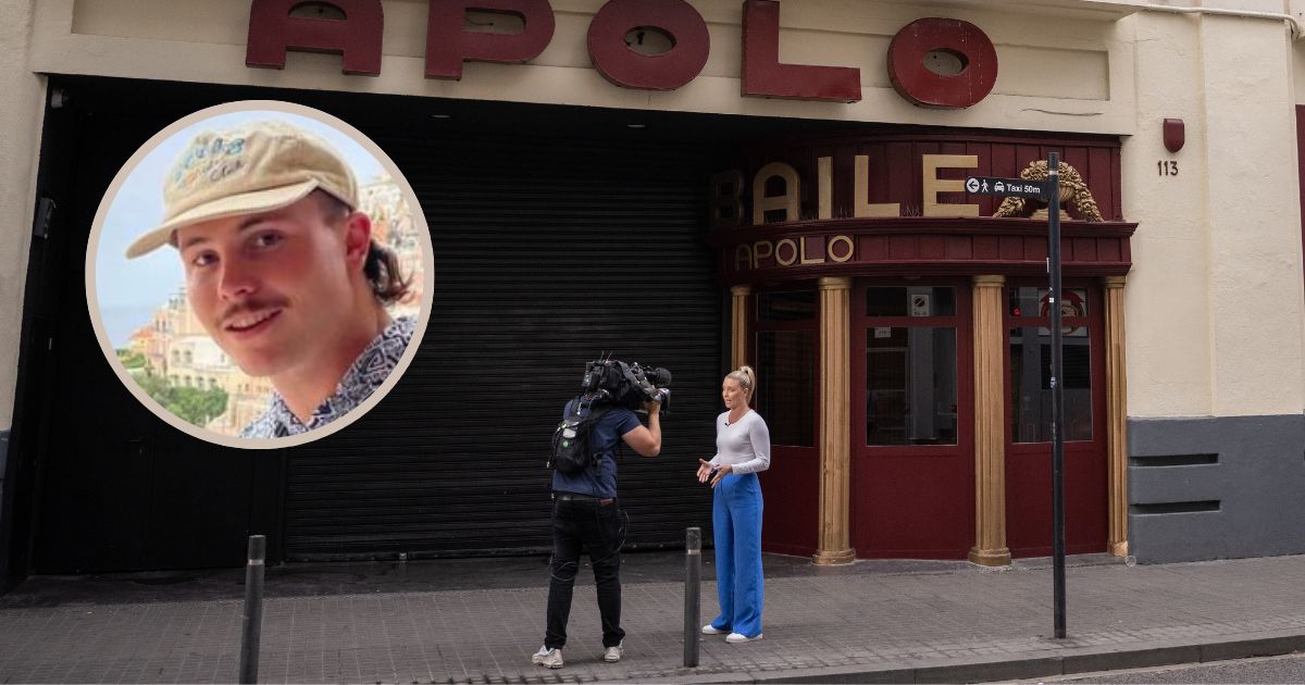 A TV journalist stands next to the Sala Apolo nightclub in Barcelona, Spain, where the body of Australian rugby player Liam Hampson was found Wednesday.