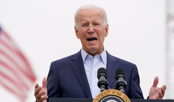 President Joe Biden speaking behind behind a lectern