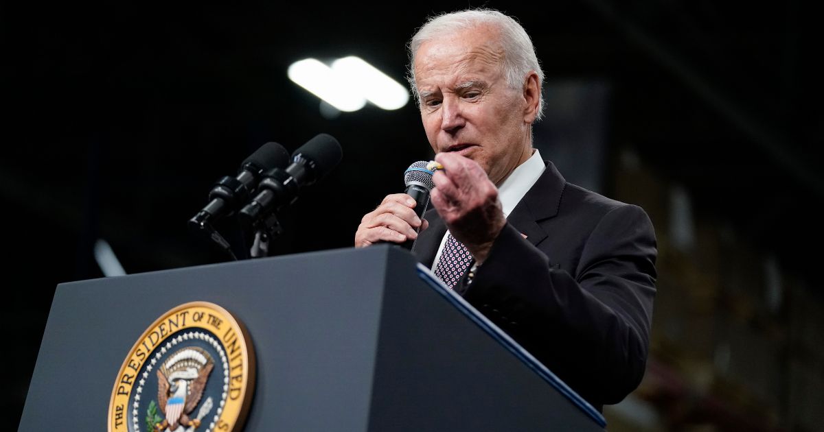 Joe Biden looking at a cough drop