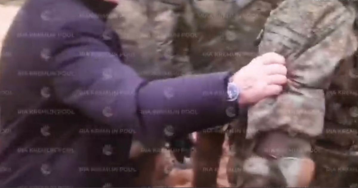 Video of Russian President Vladimir Putin recently visiting Russian troops has many speculating that the leader may be in declining health after some people noticed something about his hand, left, grabbing onto a Russian soldier, right.
