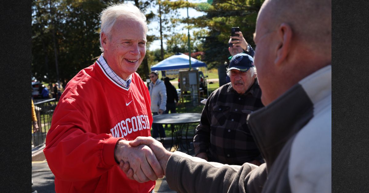 Wisconsin GOP Sen. Ron Johnson greets people during a campaign stop at the Moose Lodge Octoberfest celebration October 8 in Muskego. Johnson will face Democratic contender Mandela Barnes in the mid-term elections.