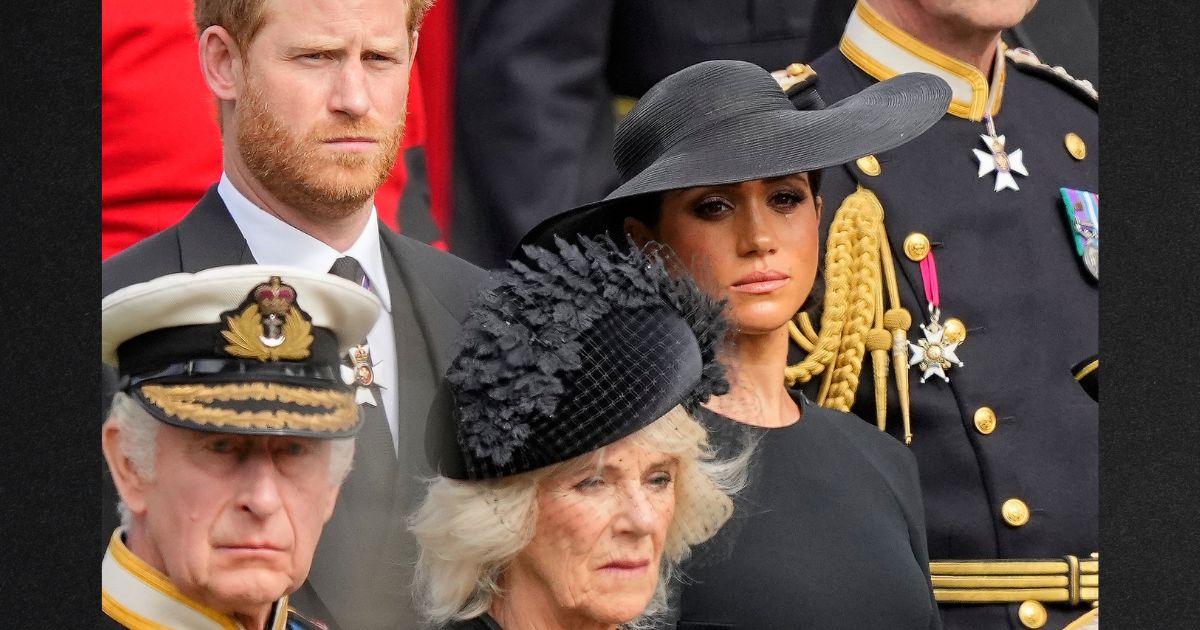 Britain's King Charles III, from bottom left, Camilla, the Queen Consort, Prince Harry and Meghan, Duchess of Sussex, watch as the coffin of Queen Elizabeth II is placed into the hearse following the state funeral service in London's Westminster Abbey Sept. 19.