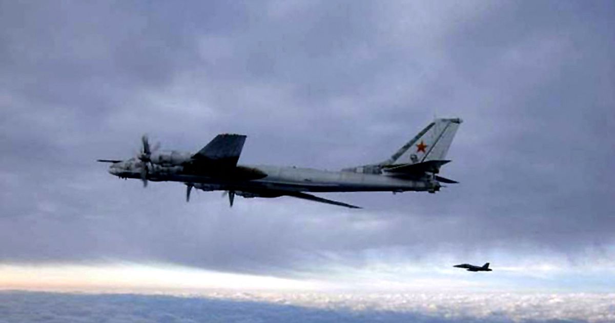 An F/A-18 Hornet escorting a Russian Tu-95 Bear bomber