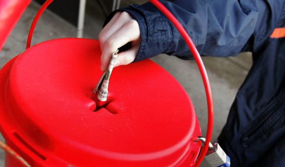 A donation is made into a Salvation Army donation kettle on Dec. 20, 2005, in Park Ridge, Illinois.