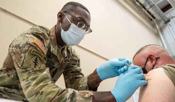 Sgt. 1st Class Demetrius Roberson administers a COVID-19 vaccine to a soldier at Fort Knox, Kentucky, on Sept. 9, 2021.