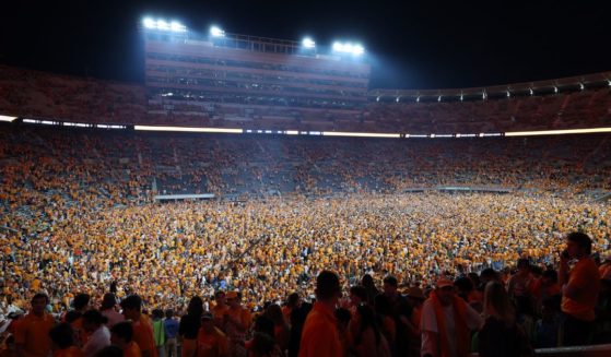 Tennessee fans rush the field after the Volunteers defeated the Alabama Crimson Tide at Neyland Stadium in Knoxville on Saturday.